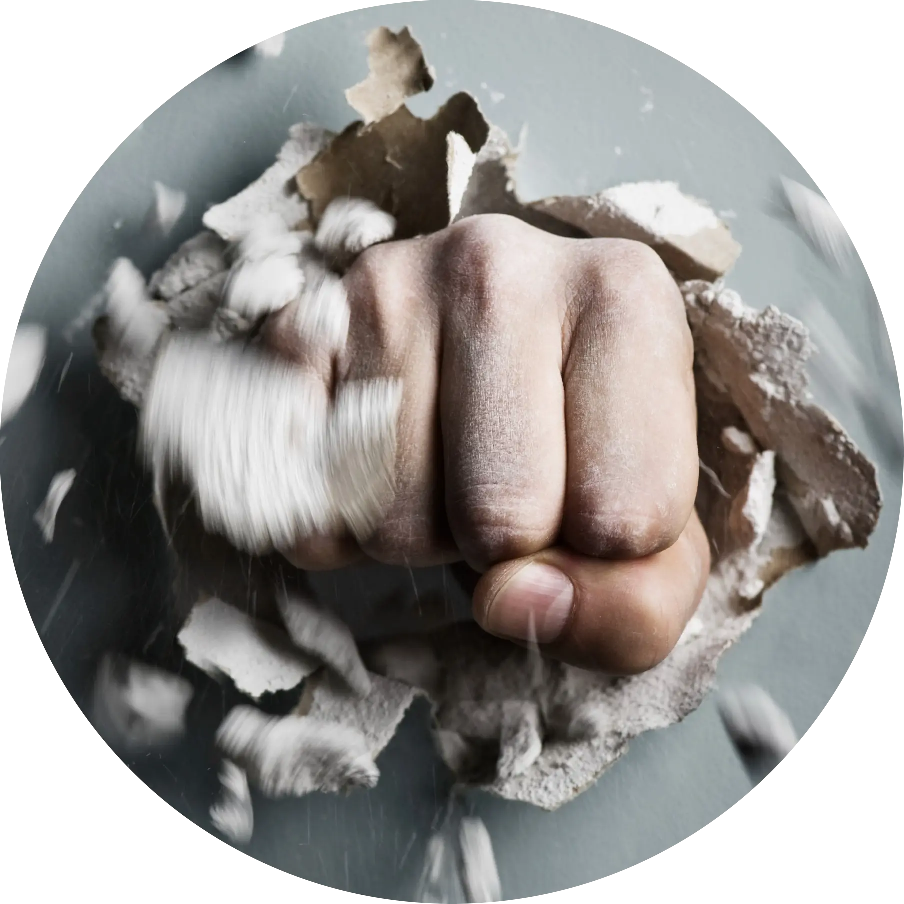Hand breaking through paper symbolising anger and emotional release